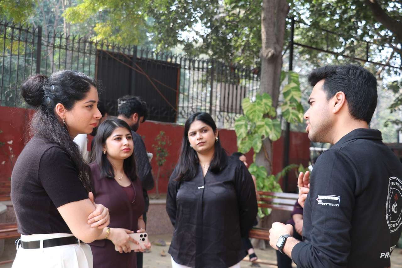 The Shiksha Nerd team talking with students on a college campus